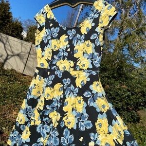 Guess flirty sundress. Pristine floral mini dress with lattice detail down back.